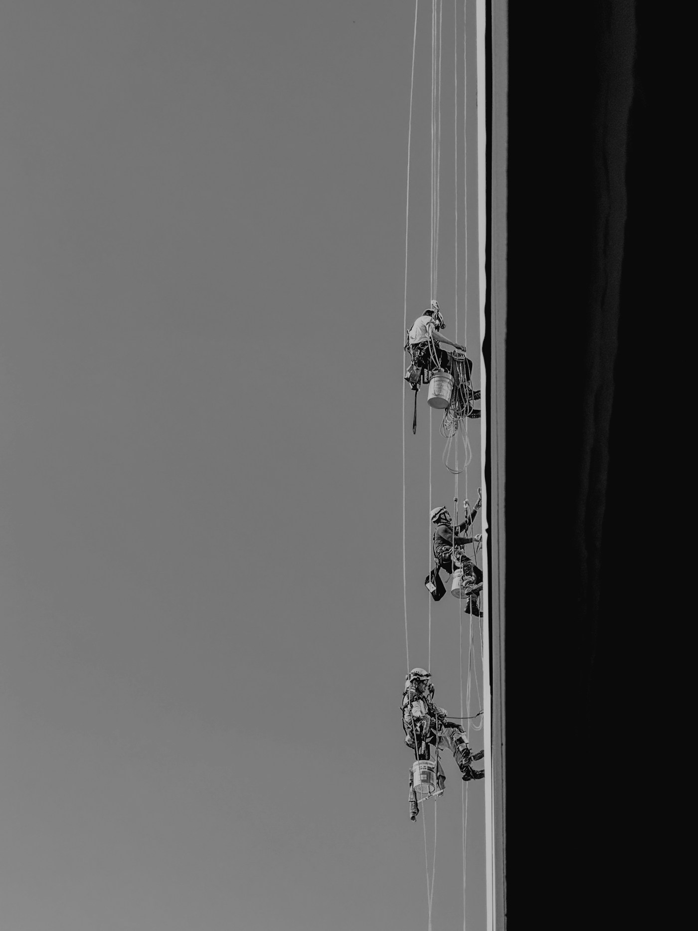 Rope access technicians on a high-rise façade
